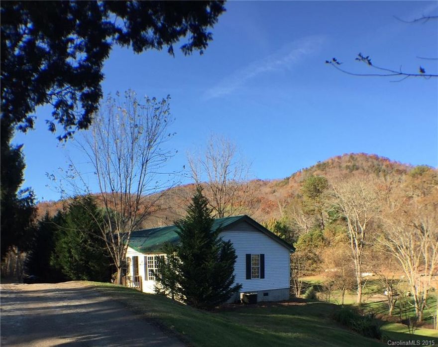 Don't let the Horseshoe address fool you, this home is only 5 mins to new Mills River Ingles & 25 mins to downtown Asheville.  Postcard gorgeous, mostly level property with creek, small waterfall, multiple fruit/flowering trees. Charming old barn, new 24x32 three bay detached gar, new roof, HVAC & well pump. Spacious interior w/split plan. Fplce can be gas or wood. Master w/2 walk in closets & huge bath. BR's 2 & 3 w/walk in closets. 3 car side gravel drive. Walk to trails. Financing available.