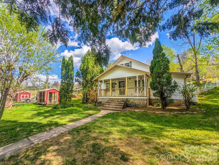Step into the charm of Country Living with this older farmhouse nestled on 4.57 acres in South Toe Community..  Perfect for a mini-farm, the property features fenced pasture ready for horses, cattle or you might want some chickens, too! New multiple metal buildings presently used for barn, storage, dog kennel w/dog run, plus 2 older wooden garage & storage buildings provide space for all your needs...whether farming or artist's needing studio space. Inside the farmhouse has been thoughtfully updated while maintaining its warm, inviting character.  Improvements include new kitchen cabinets, range, refrigerator, dishwasher, microwave, washer, dryer, along with some new flooring and some new insulated windows. Living room features wood burning stove plus gas logs in fireplace. Main bathroom has tub/shower plus washer/dryer located here. The primary bedroom has added half bath, plus access to a brand-new covered side deck -- an ideal spot to relax and take in the peaceful surroundings. Upper level has attic/flex space that's presently used as 2nd bedroom and sitting area.  However, ceiling height in middle of room is 6', 11 inches in height, down to 5'4" at sides. Total measurements including low area is approx. 1,378 sq. ft. Total measurements excluding low area at sides is approx. 1,064 sq. ft. Adding to the property's unique appeal is a classic stone spring house, perfect for storing apples, potatoes or those home canned goods. There is a swift flowing branch along northwest property boundary. This property truly feels like going home to Grandma's ...simple, comfortable and full of heart!
