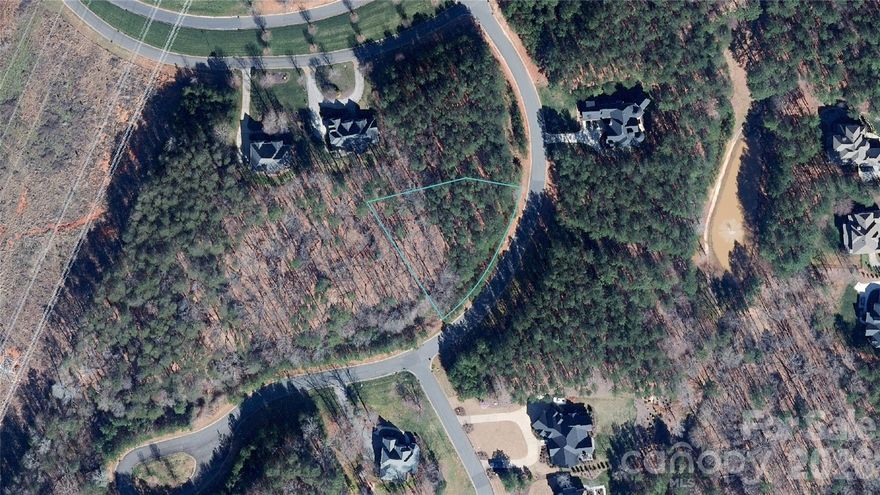 Great lot location in the Lake Wylie waterfront community of Reflection Pointe.  The lot is .65 acres with 239' of street frontage.  The lot has a slight slope from the right to the left when facing, and is suited for crawl or basement/walkout construction.  The minimum build is 2000 HLA for a 1-story and 2400 HLA for a two-story.  The home must meet the community requirements as outlined in the builder's guidelines.  You can work with current "Featured Builders" or your own.  The builder must meet the requirements in the building guidelines.  Reflection Pointe offers a community clubhouse, pool, tennis/pickleball courts, paved walking paths, a recreation/soccer field, a waterfront pavilion, a marina area, and boat storage.  Communit is 10 minutes from downtown Belmont, which offers a small town feel with restaurants, pubs, breweries, retail, parks, and more.  The commute to Uptown Charlotte is 30 minutes, and if you travel 20 minutes to the airport.  Reflection Pointe is a "true" custom home built community.