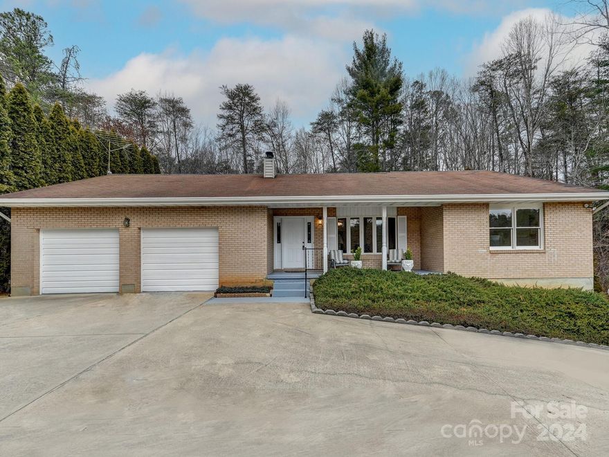 First time on the market in Weaverville! This full brick home complete with unfinished basement has endless possibilities.  Refinish the basement and increase sq. footage or use as is for storage and workshop.  Main level living features an open living room with an abundance of windows to let in the light.  The primary bedroom is oversized and features two closets and a wall of windows.  Two car attached garage on main level with ample space for storage leads you right into the kitchen and pantry area.  Open kitchen and dining room feature a large walk-in pantry and french doors that lead to the outside back deck.  Perfect for relaxing or grilling.  Flat backyard with ample room for gardening, kids or your furry friends.  Home was built with 10" walls, 5/8" rebar in foundation, 2x6 stud wall framing throughout, and 3/4" T&G plywood flooring.  Half of roof is being replaced where storm damage has occurred. Lawnmower conveys with home.