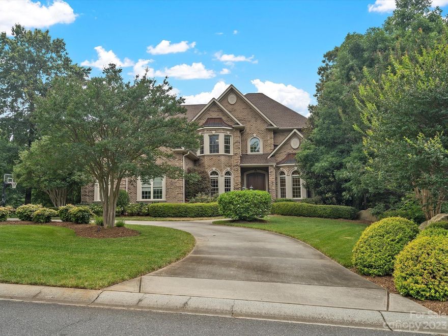 Beautiful custom home w/unbelievable finished basement! Original owner thought of every detail when they designed this home q/it's pleasant flow for entertaining & multiple flex spaces. Dining room & formal office w/French doors greets you as you walk in & takes you to generous sized great room w/fireplace & built ins.  Expansive kitchen is the heart of the home w/two islands, breakfast area plus a keeping room complete w/fireplace & built-ins. Sizable screen porch invites you to relax & unwind. Main level guest room & full bath. Journey to the 2nd floor via one of two staircases & you'll find the primary bedroom w/sitting room & a private porch, plus 4 generous sized add'l BRs, a large laundry room w/built in storage & 400 sqft of walk up attic space. The finished basement has no limits offering a kitchen/breakfast, a BR, full bath, gym, huge great room, double sided fireplace, 2 rec rooms, workshop & more! Impressive level, private backyard surrounded by mature trees!