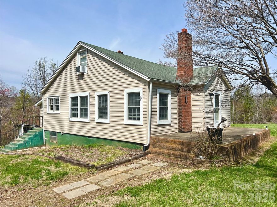 Endless Opportunities! This 3 bed 2 bath home features plenty of options, sitting on over two acres! Convenient floorpan with two bedrooms downstairs, and a large bedroom upstairs that could also be used as a den area, office, play room, etc. with a full bath up there as well. A great opportunity to have a property with more land right in Hickory. Positioned along NC Highway 10, this home offers convenient access to shopping, dining, and major routes around Hickory. The home has been sitting vacant for a little while and could use some TLC, but could be a great opportunity for someone!