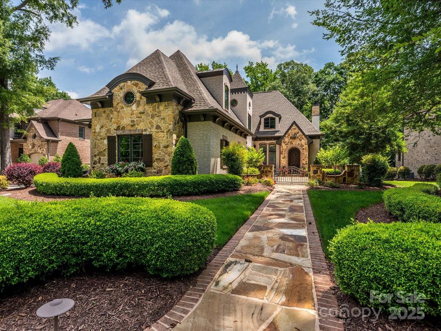 Amazing one-of-a-kind home with custom details throughout, ideal for entertaining. Courtyard entry with fountain opens to an arched foyer and soaring ceilings (10’+ main, 9’ up). Great room features coffered ceiling, cast-stone fireplace with built-ins, and flows to the chef’s kitchen and covered terrace. Kitchen offers large double granite island, custom cabinetry, Sub-Zero fridge, Wolf range with griddle, pot filler, built-in espresso machine, speedcook oven, and walk-in pantry. Centrally located wet bar with ice maker, remodeled in 2022 along with the half bath and laundry room. Spacious primary suite with ceiling detail, spa bath, and custom closet. Private office, drop zone, loft/bonus, and walk-in attic.

Outdoor living includes a covered terrace with fireplace plus patio with built-in Memphis grill overlooking private wooded yard. Recent updates: roof (2021), repainting inside/out (2022 & 2023), new HVAC units for both levels (2023 & 2024), tankless water heater rebuild (2021). Energy Star rated with sealed crawl space, plantation shutters, cameras, speaker system, and more. Move-in ready with modern upgrades and timeless design.