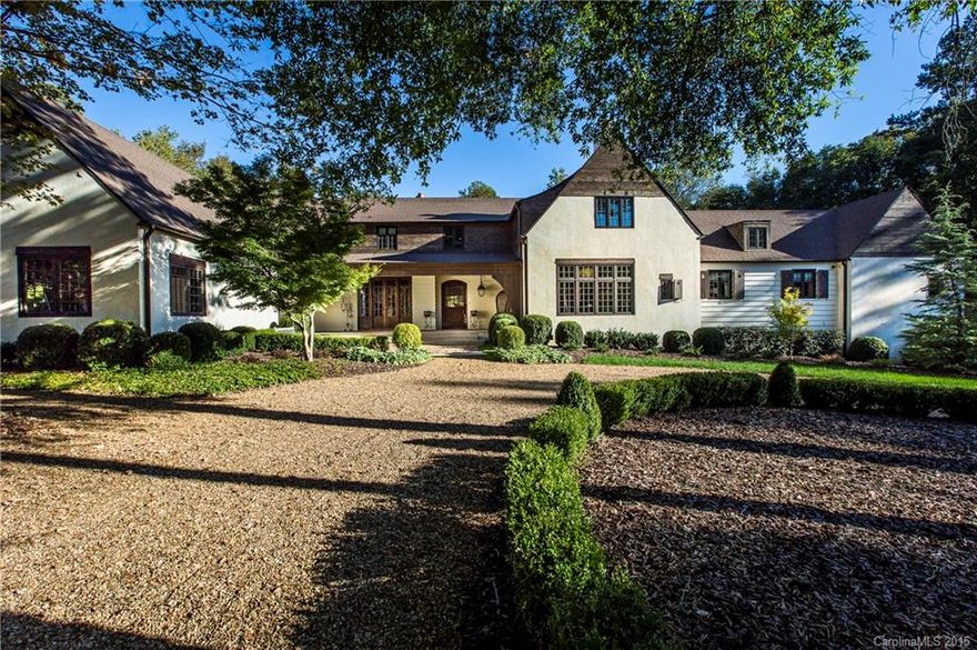 Stunning privately gated estate home in coveted south Charlotte neighborhood on over 9 acres. Completely rebuilt in 2012. Entertainers dream w/ state of the art kitchen including Wolf appliances, sub-zero fridge & marble counter tops. One of a kind home with genuinely unique workmanship. Walnut floors, lighted agate wet bar + too many more details to list. Exquisite outdoor oasis includes covered veranda/fireplace, built in kitchen, gunite pool, spa, fire pit, koi pond & spectacular gardens.