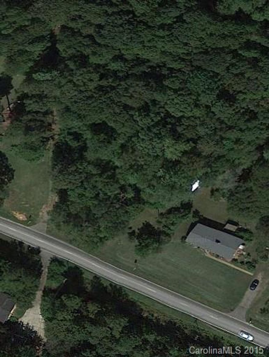 3.25 Acres on Highway 160 East just after the new Fort Mill bypass crosses over Highway 160. 250.92 feet of frontage on Highway 160 and 238.85 along the Springs Green way along the back. Property has a well left over from the old residence but Fort Mill City water and sewer run along front of property and can be connected. Perfect location for redevelopment. Zoned RC-1 but could be rezoned