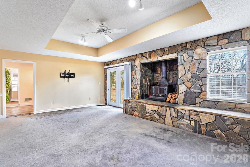 3BR/2BA home built in 1990 offering approx. 1,948 sq ft. Features include granite countertops, soft-close kitchen cabinets, stainless steel appliances, and a stone wall with fireplace in the living room. Both bathrooms include garden tubs. Unpermitted  Detached 32x32 garage with double manual doors offers an additional room and storage space. In-ground pool (approx. 512 sq ft; 3 ft shallow end, 8 ft deep end); Home will need some updates. Mature landscaping includes apple, pecan, and peach trees. Property being sold as-is.