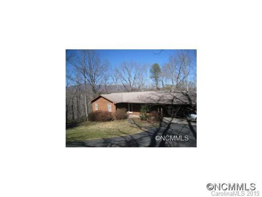Remodeled & updated light & bright home must be seen to be appreciated! Close to downtown Tryon on a wooded lot w/privacy & winter mountain views. Spacious dining rm w/built-ins, living rm w/gas log FP, built-ins & glass doors to deck w/natural views. Open plan kitchen w/breakfast bar, utility rm w/pantry. Master bdrm w/ensuitebath, 2 guest bdrms & guest bath. Walkout unf. basement w/high ceilings, heated & cooled offers unlimited potential!