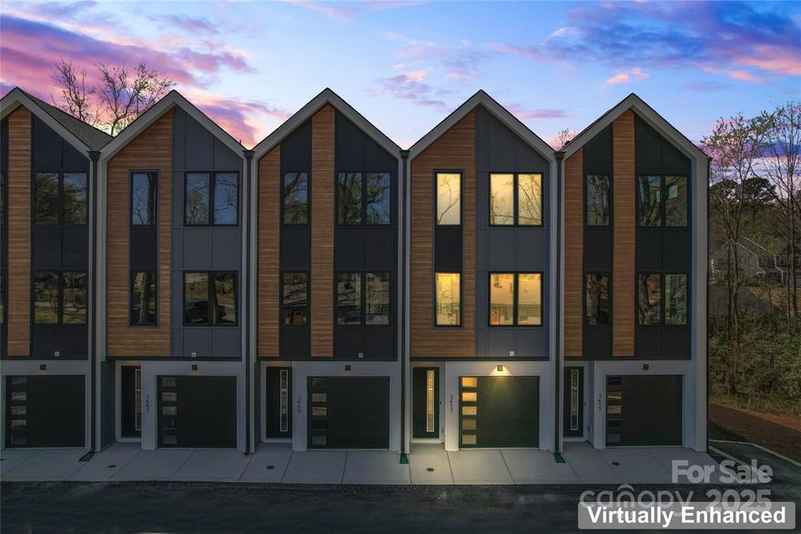 Last unit left! Closeout Pricing!  Live near NoDa, enjoy a walkable neighborhood, and short 10 minutes drive to uptown and all that Charlotte has to offer!  First floor entry with 2 car garage and private en suite.  Upstairs offers a show-stopper chef's kitchen with extra large quartz island with seating, range hood, modern gold accents, microwave drawer, sleek finishes and a separate dining area.  Large gathering room with powder and balcony. Upstairs, enjoy a retreat  with an impressive large primary bedroom, spa-inspired bath, and generous walk in closet. Another bathroom and full bathroom for convenience.  Home includes upgraded features such as dual stairs, Revwood flooring, designer selections, and Sherwin-Williams paint.  Smart features include a Ring Doorbell, myQ garage door opener with camera, and wireless thermostat. The perfect mix of trend, location, and low maintenance luxury,