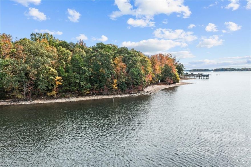 Waterfront lot with amazing views year round!!!!!  Build your dream home on this level waterfront lot sitting on the main channel of Lake Norman.  It is west facing for beautiful sunset views on the desirable location of Kiser Island.  It is a wooded lot - providing privacy.  There is approximately 121 ft of shoreline (estimated lot line).  Duke Energy Lake Services have reviewed this lot and it meets their guidelines for an application for a pier permit.