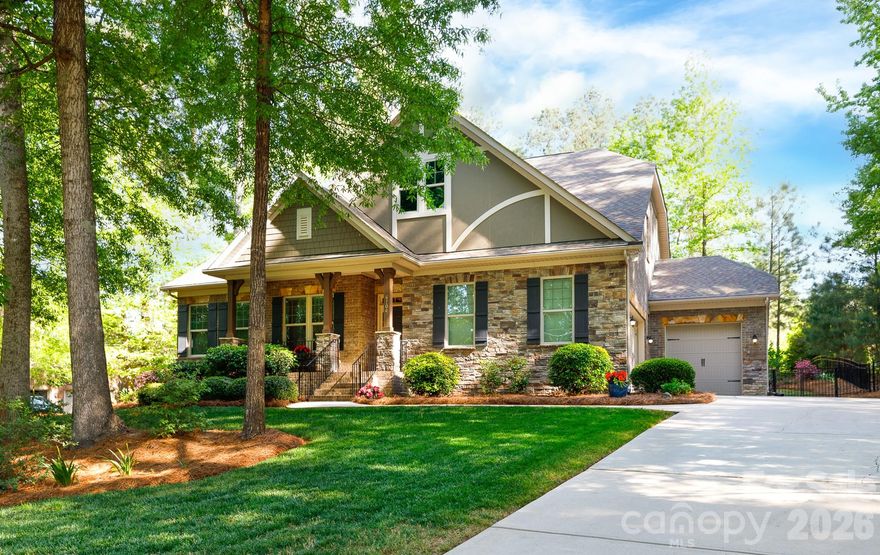 Experience Lake Wylie luxury in this stunning Energy Star Certified home in the desirable Heron Cove community. The open-concept interior features a sophisticated living room with coffered ceilings and a cozy fireplace, leading into a gourmet kitchen equipped with a spacious work island, a five-burner gas cooktop, a wall oven and microwave, upgraded lighting, and a pantry. The main-level primary retreat serves as a true sanctuary, featuring custom organizers by Closets by Design, including a built-in vanity, plus a spa-like bathroom with a separate tile shower and soaking tub. Two additional bedrooms and a study are also conveniently located on the main floor, while the upstairs offers two additional extensive bedrooms, which could double as a bonus or recreation space. Outside, the beautifully landscaped, fenced backyard is abundant with flowering trees, shrubs and flowers, providing a private retreat for relaxation. Enjoy community perks of the pool and lake access for kayaks and canoes, plus nature trails. The upcoming Pennies for Progress project will install a traffic signal at the neighborhood entrance, ensuring easy and safe access from the main road.
