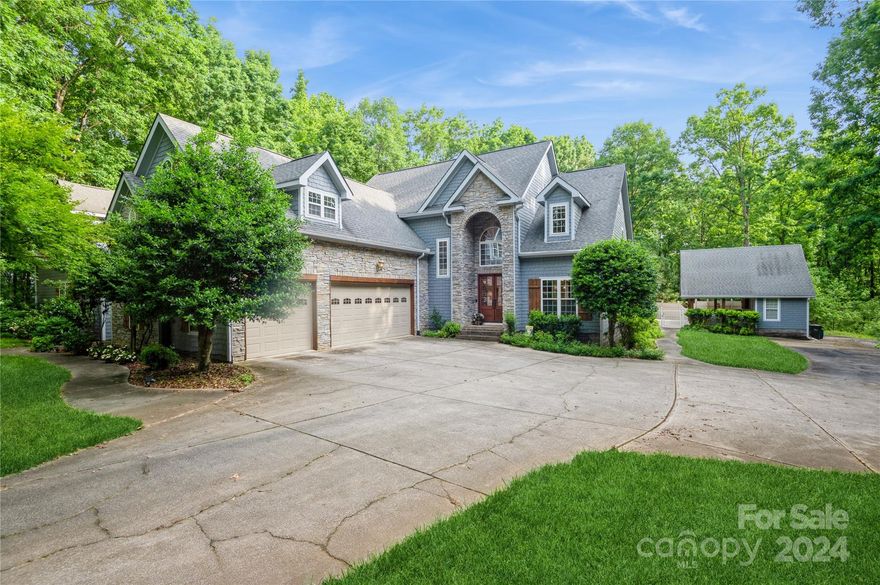 Tucked away in its own private retreat, this incredible custom home really has it all! At almost 6800 square feet it's a unique & hard to find gem on almost 3 acres.  So many amazing features including 2 Kitchens, 2 Primary Bedrooms w/ en suite baths, 2 laundry rooms, a recreation/game room, a home theater, a lovely terrace & patio overlooking a gorgeous in-ground salt water pool.  With two complete individual living quarters this space can be utilized many ways.  In addition to main home, there is a pool house w/ outdoor covered patio & full bath & a 2-car detached garage w/ room above & full bath.  Total of 7 Full Baths & 2 Half Baths at this property.  Imagine a day by the pool which will have you feeling like you're vacationing at a tropical resort & later enjoy a movie in your own spectacular home theater!  All this in Matthews w/ easy access to the highway, shopping, dining, medical facilities, etc.  Theater equipment & seating, air hockey, foosball & ping pong tables to convey.