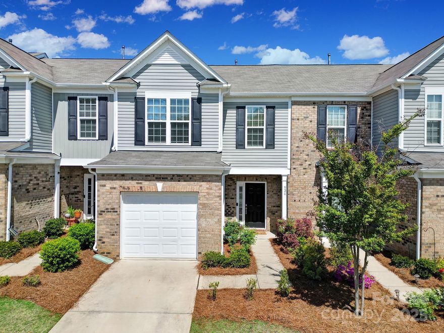 Prime Location in Catawba Village! Discover this charming 3BR, 2.5BA townhome in the gated, resort-style community of Catawba Village offering low HOA fees and no Fort Mill city taxes! Built in 2019, This 1,542 sq ft home features an open layout with luxury vinyl plank flooring, neutral tones, and a cozy fireplace. The kitchen shines with quartz counters, stainless appliances, white cabinetry, a breakfast bar, pantry & dining area that’s perfect for entertaining. Upstairs, the primary suite boasts board & batten accents, tile shower, dual vanity, and walk-in closet. Two more bedrooms share a full hall bath, with tile in all baths and the laundry room. Step out to a fenced yard for relaxing or entertaining, with the bonus of a main-level powder room and attached garage. Community perks include a clubhouse, pool, walking trails, and pond—all for just $165/month. Zoned for top-rated Fort Mill Schools and minutes from I-77, I-485, shopping, & dining. Move-in ready—don’t miss this gem!