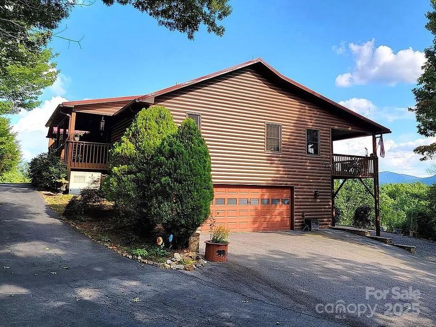 Welcome Home to 914 Rogers Rd, a mountain-top retreat offering privacy, breathtaking long-range views, and endless possibilities across 6.64 acres with seven separate lots. The main home features 1,621 sq ft of updated living space, including 2 bedrooms, 2 bathrooms, and an open floor plan with LVP and laminate wood flooring throughout. The cozy living area centers around a fireplace, and the kitchen and bathrooms have been updated for a modern feel. The finished basement adds 929 sq ft of versatile flex space with a third full bath, perfect for a third bedroom, office, or guest suite. Outdoor living includes an oversized deck, an observation deck above the patio, a detached RV garage, and a large open-air barn, ideal for storage or hobbies. With updated interiors, expansive outdoor areas, and sweeping views, 914 Rogers Rd offers a rare opportunity for mountain living. Experience this unique property — schedule your private showing today!