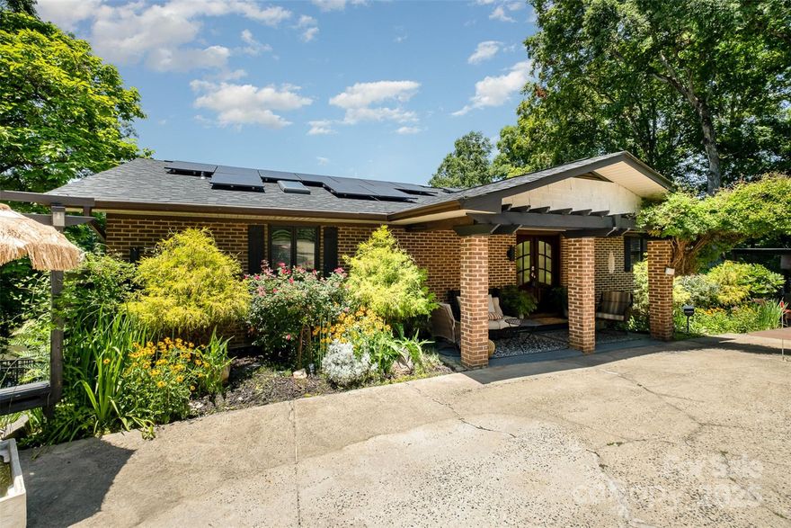 Don't miss your opportunity to own this iconic Lake Wylie waterfront home in Browns Cove on a nearly level lot.  Lake living in the heart of the city, this home is situated close to the water and has an incredible amount of dock space! The domicile is an entertainer's dream with open concept living, a primary on the main with two walk-in closets and a sauna, an additional primary on the lower level with claw foot tub, and water views from every room. Each bedroom has its own oversized bath with huge shower. The 4 season sunroom is sure to become your favorite space. The property features a floating boat house with two enclosed slips, boat and jet ski lifts, a paddle boat, paddle boards, kayaks, swim platforms and a gazebo, all in deep water. The grounds are beautifully landscaped with numerous outdoor entertaining areas, koi pond and two waterfalls. Close to shopping, dining, freeways, the airport and The River District. City water/sewer available at street.