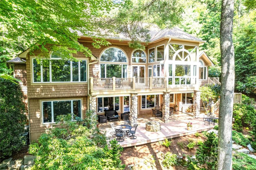 Spacious & Elegant Home on the 5th Fairway in Prestigious, Member-owned Golf Course Community of Champion Hills—Home to Tom Fazio’s Masterfully Designed Course, Consistently Ranked among the Best in the Nation. Upon Entry You're Welcomed by a Wall of Windows Showcasing Golf Course Views and Stunning Floor-to-Ceiling Stone Fireplace. Beautifully Renovated Kitchen has Breakfast Nook with Scenic Vistas, and Four Season Room offers the perfect spot to relax year-round. Main Level features a Spacious Primary Suite. The Lower Level is ideal for Entertaining or Extended Guest Stays- Large Family Room Features another Stone Fireplace, Ensuite Bedroom, Plus 2 more Bedrooms, 2 Full Baths, Bar Area, and Generous Storage. Outdoor Living: Spacious Terrace & Deck, Manmade Waterfall & Small Pond. Secluded, Tree-filled Oasis on 1.15-Acre Lot with wildlife to enjoy. Updates 2024. Amenities-Golf, Tennis, Pool, Clubhouse, Fitness Center, and Dog Park. 10 min to Hendersonville and top medical facilities.