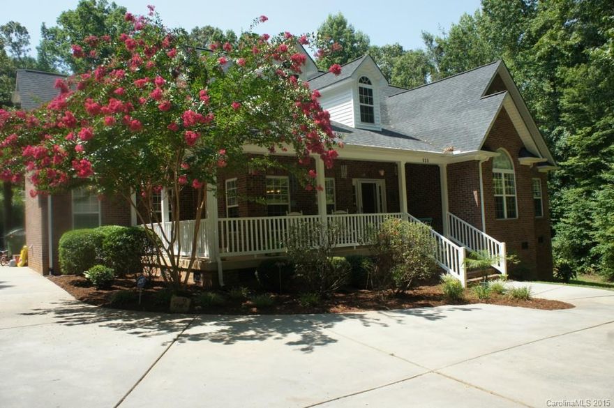 Fabulous full brick 1 story home on 1.5 acres private lot! This 3 bedroom 2.5 bath home features an open floor plan, spacious LR w/ fireplace, vaulted ceilings, hard woods. Beautiful kitchen flows comfortably into formal living room/breakfast area with tons of kitchen cabinets. Laundry w/ sink and 2nd fl. perfect for storage/office. Front/Back covered porch. Inground pool, fenced large back yard wooded lot w/ tons of privacy. Just minutes away from Ballantyne restaurants,shopping. Low SC taxes!