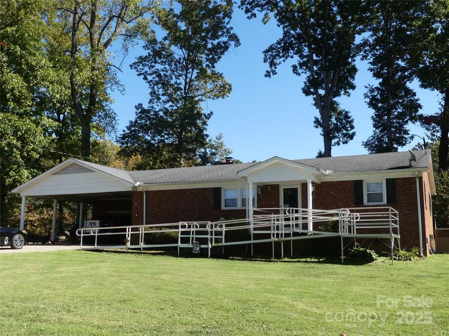 So many features to list such as:  A movable kitchen island w/storage, farm sink, hard surface countertops, soft close cabinets, glass window cabinets, recessed lighting, ALL appliances stay.  That's just the kitchen.  A separate laundry room with tile flooring, cabinets and sink and the washer/dryer stay.  Full Bath - newer bath shower insert, vanity.  Workshop area in the garage, double covered carport, spacious double concrete driveway, fenced backyard with a large concrete patio.  Flex room and storage space in the mechanical room.  
The ramp going to the front door is negotiable.