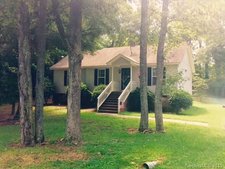 TUCKED IN THE TREES, private lot with city convenience! 3BR, 2FB, split bedroom plan, cathedral clg in GR, master suite with amenities, walk-in closet, spacious KT w/ stainless steel appliances, gas logs in GR, laundry room, deck overlooking private backyard, some fencing, building for storage, HVAC replaced in 2011, seller to provide warranty with acceptable offer, will not last, call for a preview!