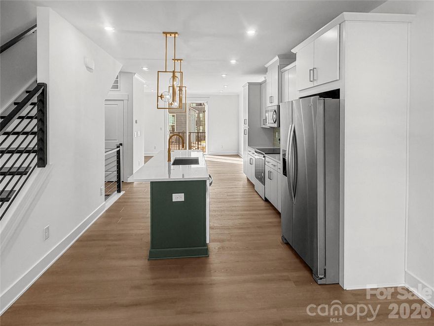 Experience modern luxury in the heart of LoSo, one of Charlotte’s fastest-growing areas. This brand-new, move-in ready Dunbrook floorplan townhome, tucked back into the community, offers 3 bedrooms, 3.5 baths, and a 2-car garage—with a private en-suite bath in every bedroom, ideal for roommates or guests.

Designed for seamless indoor-outdoor living, the open-concept main level extends from the Great Room to a outdoor living area, while the rooftop terrace provides an elevated space for entertaining or unwinding. The designer kitchen features quartz countertops, soft-close cabinetry, and a spacious island, complemented by hardwood stairs and luxury vinyl plank flooring throughout the main living areas and fourth-floor bedroom.

Additional highlights include durable Hardie Plank siding, crown molding, zoned thermostats for enhanced comfort, and abundant natural light throughout.

Located just two blocks from the LYNX Blue Line at Scaleybark Station, with quick access to South End’s dining, breweries, and Uptown.

Limited-time financing incentives available—contact agent for details.