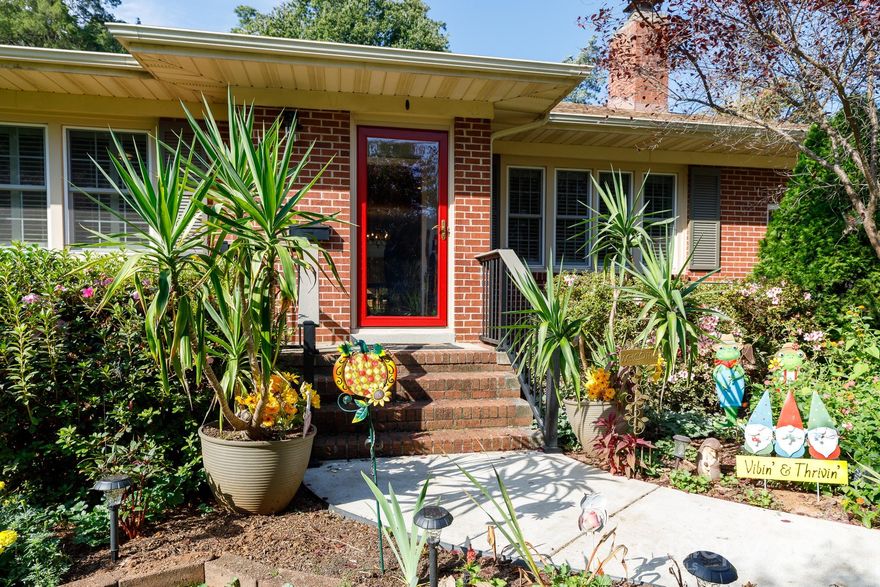 Welcome to this beautifully maintained, full brick 3-bedroom, 2-bath ranch in an established neighborhood. This home features two fireplaces—one in the living room and another in the cozy keeping room. The kitchen showcases stainless steel appliances, granite countertops, and a convenient pot filler at the range with double ovens. Plantation shutters and original hardwood floors add timeless style throughout. Enjoy meals in the spacious dining area or relax in the sunroom overlooking the private, fenced backyard. Outdoor living is truly special in the park-like backyard that is full of color, filled with mature trees, and plenty of space to relax or entertain. Enjoy evenings on the patio by the firepit, or take advantage of the storage building for added convenience. An attached garage adds practicality, while a new roof in 2024 and a Cummings generator provide peace of mind.