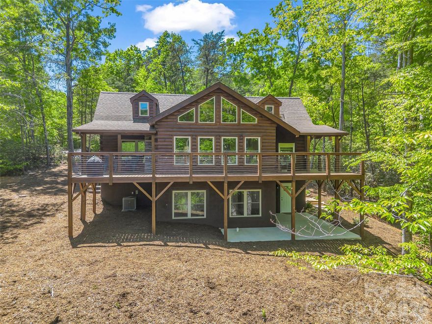 Tucked away in the heart of Lake Lure, this inviting Blue Ridge log cabin offers the perfect blend of mountain serenity and golf course living. Perfectly positioned with views of the 12th tee box and 16th green of Apple Valley Golf Course, you'll enjoy peaceful morning and stunning fairway views right from your wrap-around deck. Designed with classic log cabin charm, the home features warm wood interiors, an open and welcoming with additional guest space, rec room and storage in the finished walk out basement. Located within the sought-after Rumbling Bald community, this property offers access to an unmatched lifestyle. Enjoy two championship golf courses, miles of scenic hiking trails, wellness center with indoor/outdoor pools, fitness facilities, spa & salon, tennis and pickleball courts, and a variety of dining options just minutes from your door. Lake Lure is now open providing endless opportunities for boating, kayaking, and outdoor adventure, all within a private, resort-style setting. Whether you're searching for a full-time residence, vacation escape, or investment property, this home delivers the ultimate mountain lifestyle with resort-style amenities and unbeatable golf course views.
