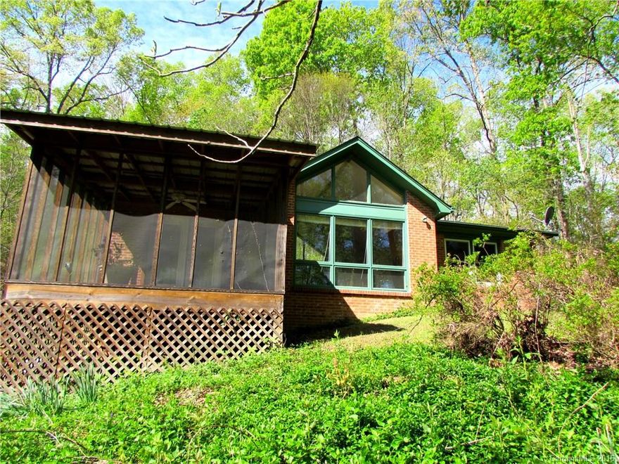 ONE OF A KIND!!! Come escape to this 8+ acre home full of privacy, scenic views and pasture. Home features 3BR/2BA, large open kitchen, bonus room and enormous amount of sunlight peeping through the windows. Escape outside on the screened porch as you look down at the pasture below or relax in a rocking chair winding down from the day. Don't miss out on this one!!!