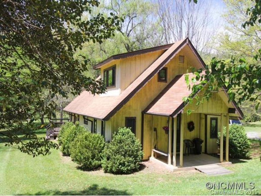 Spectacular S. Asheville Location! Build your brand new home while living in sweet 3+1.5 Guest Cottage. Enjoy relaxing evenings on back deck overlooking man-made pond stocked w/Wide Mouth Bass. Fast running year round creek w/specially engineered concrete slatted bridge. Gorgeous 5 acre lot readymade for your Dream Home Plans! Follow trail uphill thru the Enchanted Forest to see the Spectacular Views! X-from Poplar Ridge Comm. Home Appraised.