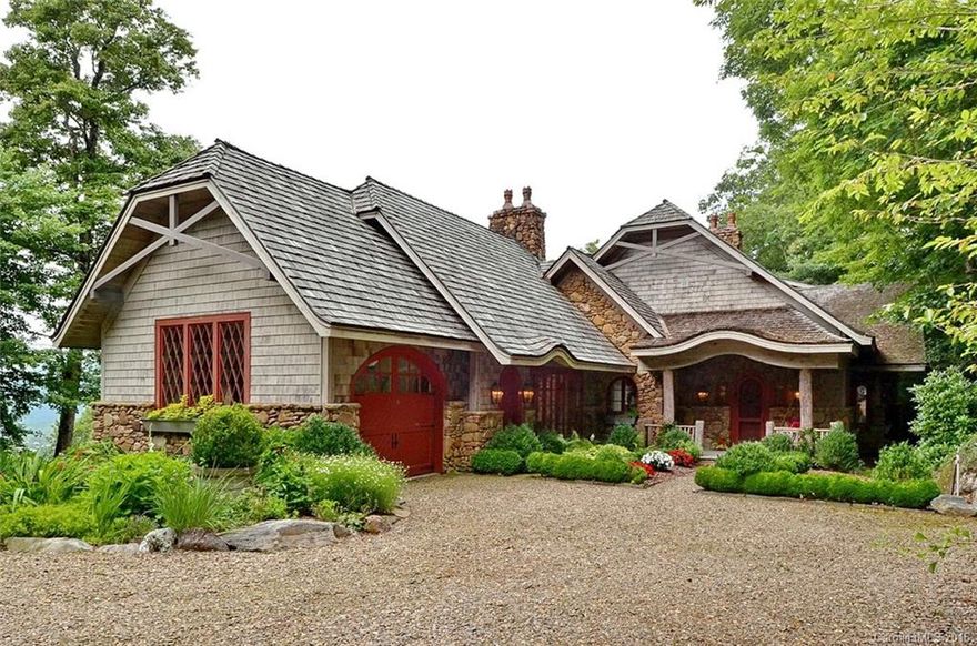 Charming custom built mountain retreat in the gated community of Big Sheepcliff, located just minutes from Cashiers. Spectacular panoramic views of the Cashiers Valley including Cashiers Lake. This warm and inviting home offers 3 bedrooms on the main level. The great room with the massive stone fireplace features exceptional architectural details and is flooded with natural light generated by the desirable southern exposure. Stone fireplaces enhance multiple rooms and outdoor spaces.