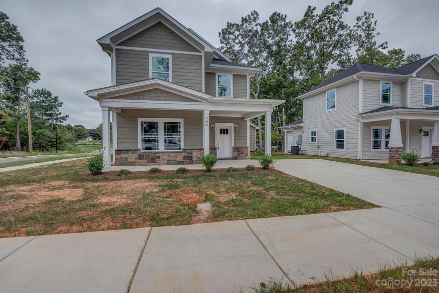 MASSIVE REDUCTIONS ON THESE HOMES! 2500.00 in seller paid closing costs. Welcome to Dixon Village, a newly built subdivision in North Belmont! This two-story Queen Anne style home offers an abundance of space and an array of desirable features. Step inside to discover a generously sized living and dining area, perfect for relaxing and hosting gatherings. There is also a convenient half-bath and the primary suite, providing comfort and privacy. The U-shaped kitchen, complete with a breakfast bar seamlessly connects to the living and dining area allowing you to entertain your guests effortlessly. The open concept design enhances the overall flow and creates a welcoming atmosphere. As you get to the second floor, you'll be greeted by three bedrooms that offer ample room, along with a full bathroom and a spacious laundry room. The luxury vinyl flooring, stunning black granite countertops in the kitchen and bathrooms, and the recessed lighting throughout make this home a true charm.