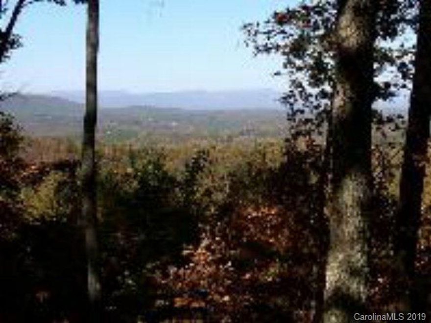 Great gentle sloping lot with panoramic mountain views in Gated Community of Grandview Peaks. Lt has magnificent views of Shortoff Mountain as well as the entire range of Blue Ridge Mountains. Enjoy privacy and seclusion in this gated community. Lot located at the end of cul-de-sac on Placid View Drive. Community lake for kayaking, canoeing and swimming. Lot will require well and septic. Located just minutes to Asheville, Marion, Morganton and Lake James.