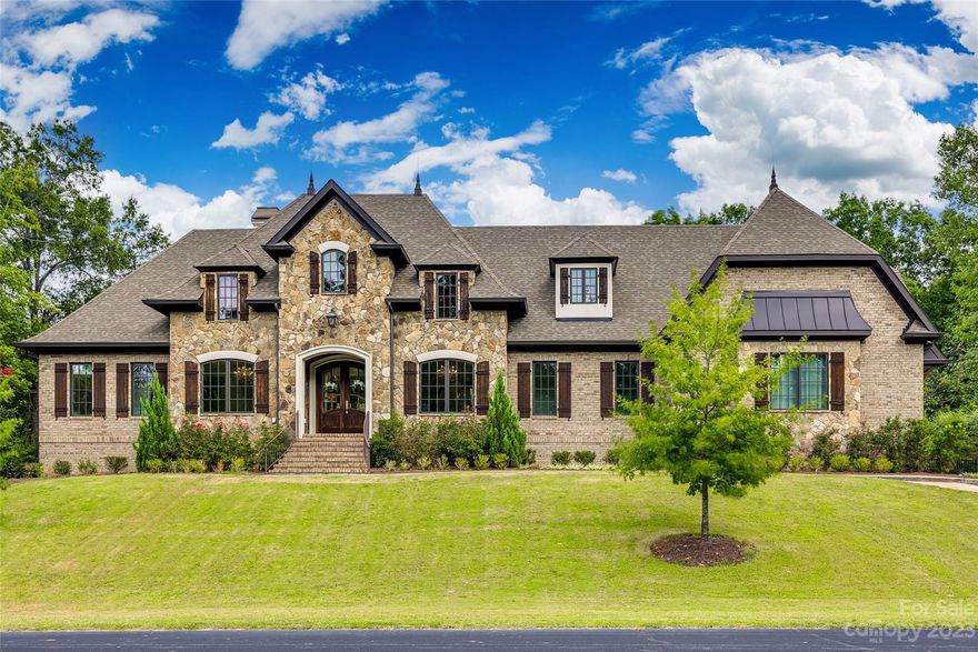 BETTER than new construction with USDA financing available! Built and timeless designed European estate by local custom homebuilder. This home is located in the private, wooded oasis of Longbrooke Estates. Thoughtful  consideration has gone into every design aspect of this home such as natural stone, functional cedar shutters, standing seam metal roof detail, copper finials, metal chimney cap, aluminum cladded casement windows and natural gas lanterns just to name a few design features. You will enjoy the dynamic roof lines, modern open floor plan and robust build quality. A stunning gourmet kitchen with all gas appliances, quartz countertops, large island, wine refrigerator & pot filler makes this a dream kitchen. This home has every feature you could dream of including high tech efficiency starting with an official Energy Star Certification and a true two zone HVAC system with conditioned sealed crawl space. The open design lets you enjoy high ceilings throughout the home. Visit now!