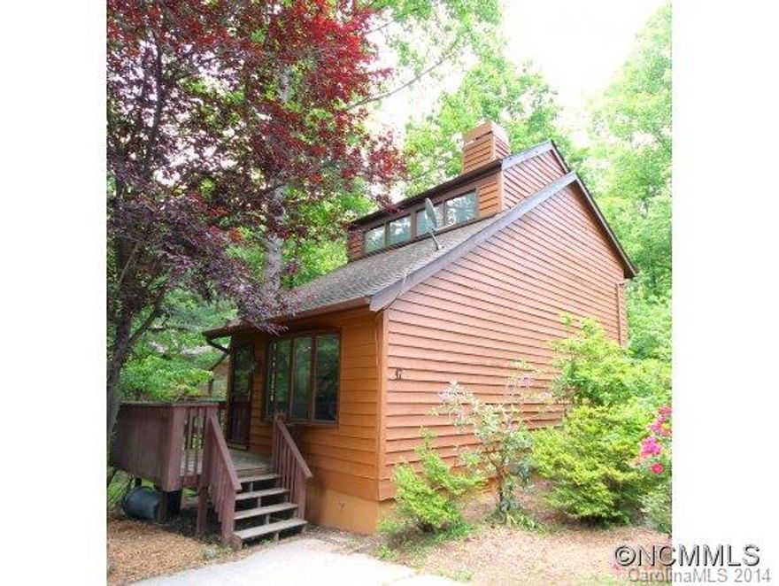 Super cute in Fletcher! Awesome setting for this low maintenance home--creek side. Tons of recent updates: new flooring in living room, kitchen, and bedroom; new exterior and interior paint; freshly painted decks.  Loft living, full bath upstairs, half-bath on the main floor, and an extra finished bump out great for storage.  Come see this one blooming in Wildwood Gardens.