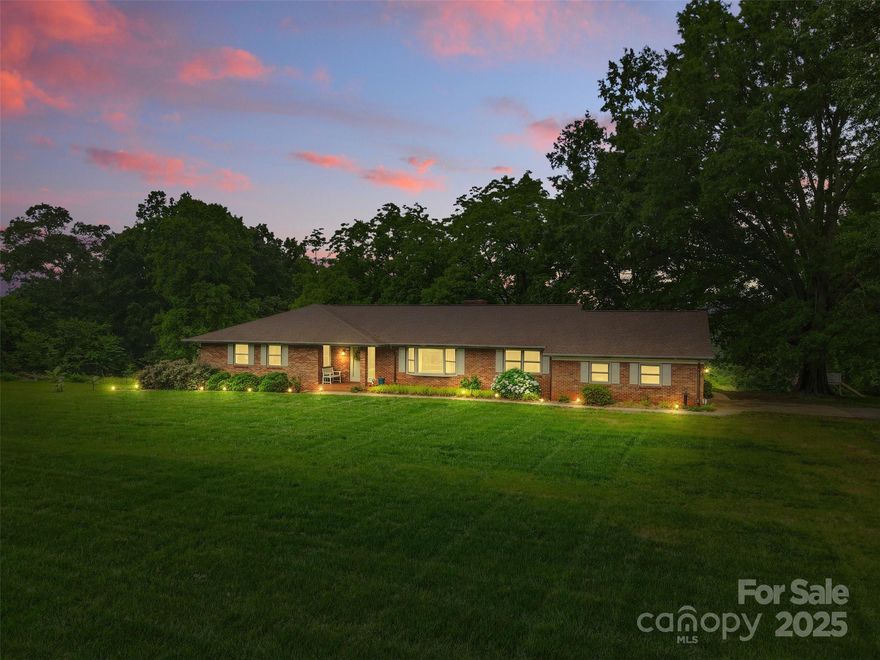 A countryside treasure with room to grow, this all-brick 5BR/2.5BA home is nestled on 33 acres—ideal for anyone longing for a slower pace & a life connected to the land. Tranquil pond, open pasture, deer & wildlife, it’s a dream setting for homesteading, gardening, or simply enjoying NC’s natural beauty. The home offers spacious living w/ a sunken living rm, formal dining & a cozy den w/ fireplace that opens to a partially covered patio & natural gas grill—perfect for relaxed evenings or quiet mornings. While it’s ready for cosmetic updates, key improvements include a new cooktop (2023), dishwasher (2024), updated flooring (2020) & fresh paint in some living areas (2025). A full bsmt offers a rough-in bath, workbenches & garage access & a large wired shed (2024) is ready for final hookup. Washer, dryer, fridge & shed convey; tractor & freezers negotiable. Just minutes from town, yet a world away—this is your chance to create something truly special. Appraised for $725k January 2025.