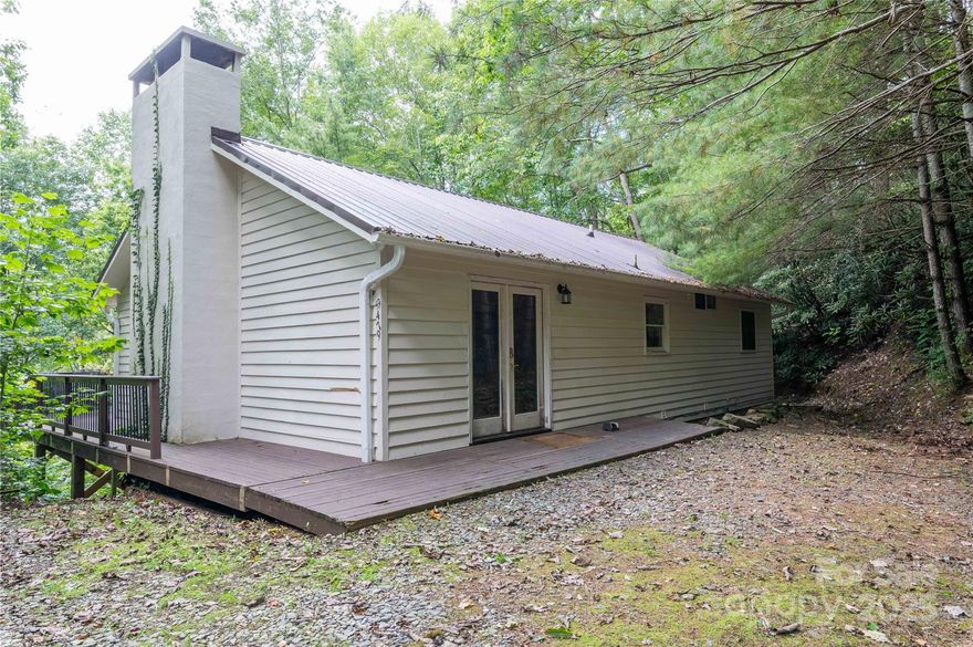 Nestled within a serene golf course community and surrounded by the pristine wilderness of the Pisgah National Forest, this exceptional 3-bedroom, 2-bathroom home offers a blend of seclusion and outdoor adventure. This isn't just a house; it's a gateway to an unparalleled lifestyle and an investment opportunity. Situated on nearly two acres of private, usable land, this property allows  peace and tranquility. Enjoy isolation from neighbors while being just minutes from community amenities. Wake up to breathtaking views and the gentle sounds of nature, with frequent sightings of deer, wild turkey, and songbirds right from your windows.  A downstairs large, open-concept family and game room provides the perfect space for a pool table, home theater, or a second living area—ideal for hosting guests or enjoying family game nights. The main living area features a warm and inviting atmosphere, a well-appointed kitchen, and three generous bedrooms, including a primary suite for rest and relaxation.  An Outdoor Enthusiast's Paradise: step outside your door into a world of adventure with fantastic fishing in the renowned South Toe River, and direct access to national park trails where you can hike, mountain bike, and explore acres of protected wilderness right from your backyard.  And with the Mount Mitchell Golf Course “in the neighborhood”, your days of leisure on the greens are just down the street. Positioned approximately an hour from the high-class amenities and cultural scenes of Asheville, Boone, and Blowing Rock, the central location makes it a short trip to amazing food and entertainment.  This home is also a proven performer for both short-term and long-term leases, capitalizing on its desirable location near national parks and fishing hot spots. It represents a fantastic opportunity for passive income.  Priced to sell, so come take a look before it’s gone!