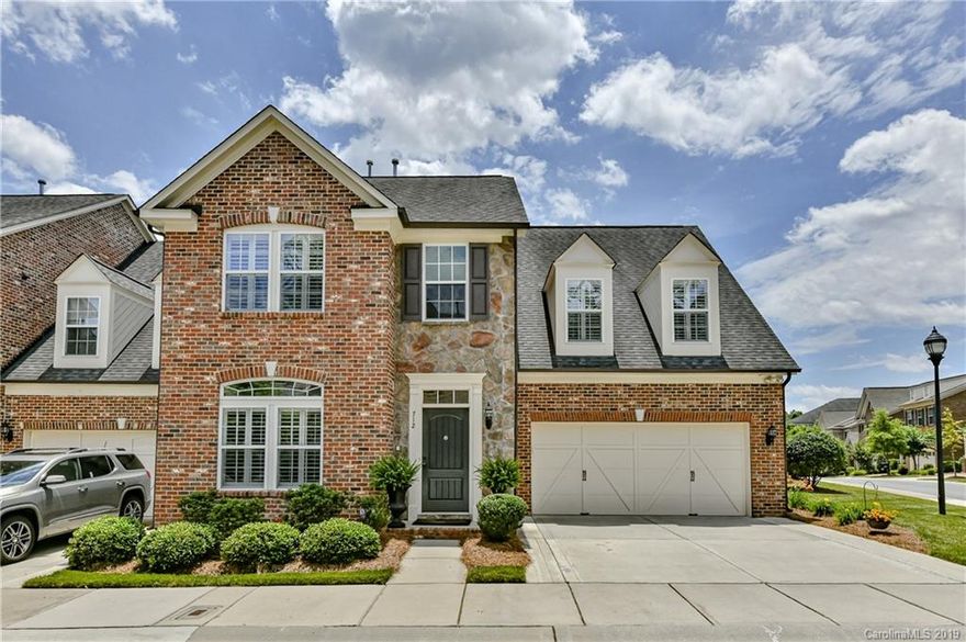 This lovely townhome is conveniently located between Cotswold shops & restaurants and I 277. Enjoy a seamless commute to Uptown.  This open floorplan lives large. The 2 story Great Room, anchored by the fireplace with gas logs, is open to the Kitchen. The cook's Kitchen has granite countertops, tile backsplash with decorative insets, 42" cherry cabinets, pantry, Butler's pantry, SS double sink and SS appliances.  Gleaning hardwood floors up and down, surround sound and 3 inch Plantation shutters throughout.  Custom designed, walk-in, Master closet.  En-suite Master bath features a large shower and a soaking tub. Oversized Bonus Room.  Abundance of storage in custom, kitchen quality, cabinets in garage. Beautifully landscaped patio area.  End unit with common area to the side gives privacy. Meticulously maintained and move-in ready.