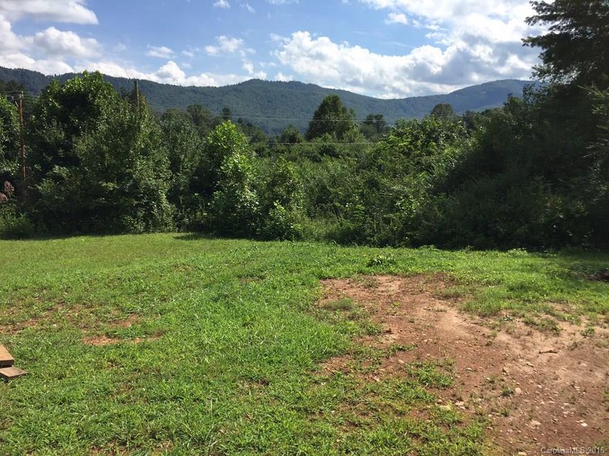Level & cleared buildable lot in Crab Creek Valley. Nice mountain Views! Older well & septic permits on file.