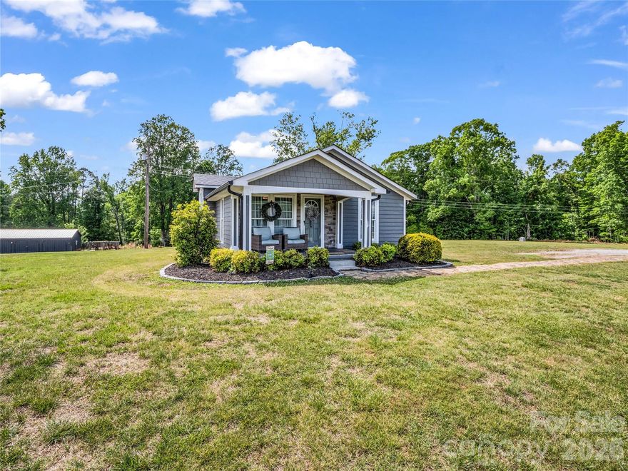 Welcome to the kind of property that makes you breathe deeper, and picture life outside the fast lane.  Nestled on 3.22 beautiful level acres, in the highly sought after Bostic area, this nicely renovated 2 bedroom, 2 bath bungalow blends modern style with peaceful country living.  The crisp gray exterior with inviting covered front porch, and manicure landscaping create instant curb appeal that feels straight out of a magazine.  Inside, you'll find a home that has been thoughtfully refreshed with today's buyer in mind - offering comfortable living spaces, updated finishes, and a warm, welcoming atmosphere throughout.  Whether you're enjoying quiet mornings with coffee on the porch and your mountain view or hosting friends for a weekend cookout, gardening, or simply soaking in the privacy and open spaces around you, this property delivers the lifestyle so many buyers are searching for today.  There is a great workshop waiting for you to create a she-shed/mancave or craft delight.  There is also an old barn out back that would make a nice mini farm with a barn for your pets.  Come see this one today!