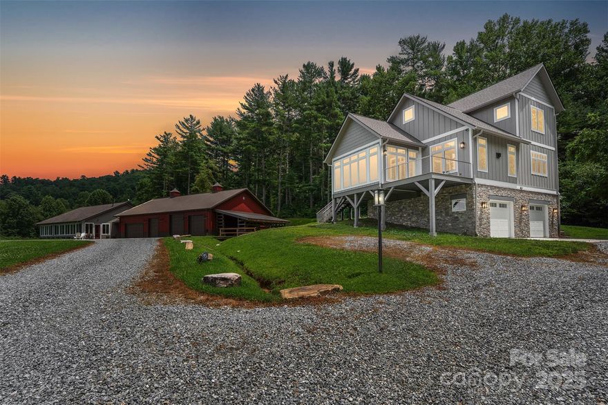 A rare opportunity to own one of Hendersonville’s most breathtaking private estates. Set on 6.55 acres with long-range views, this turnkey property features two exceptional custom homes—a 2017 main residence and a 2024 guest home—crafted with timeless style and attention to detail. Natural light pours in throughout the day, offering unforgettable sunrises, sunsets, and mountain views from nearly every window. Enjoy three full kitchens, an elevator, central vac, two whole-house generators, and heated/cooled garages attached to each home. Designed to bring loved ones together, the homes offer expansive living spaces, flexible accommodations, and future-ready comfort. A cleared pad offers space to add a third structure. Perfect as a luxury short-term rental, multi-generational retreat, or boutique venue, this estate offers elegance, privacy, and exceptional potential—a truly special property built without compromise!