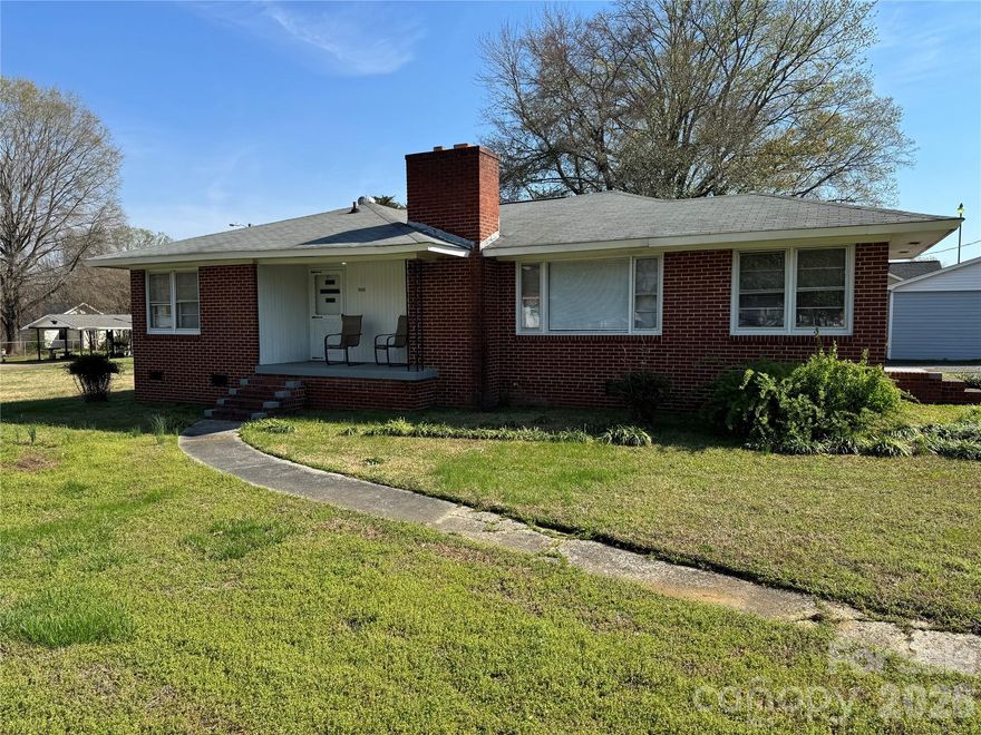 Very nice 3 bedroom 2 bath mostly brick ranch on large corner lot, new flooring, living room, den, dining area, carport and large detached workshop/garage, must see