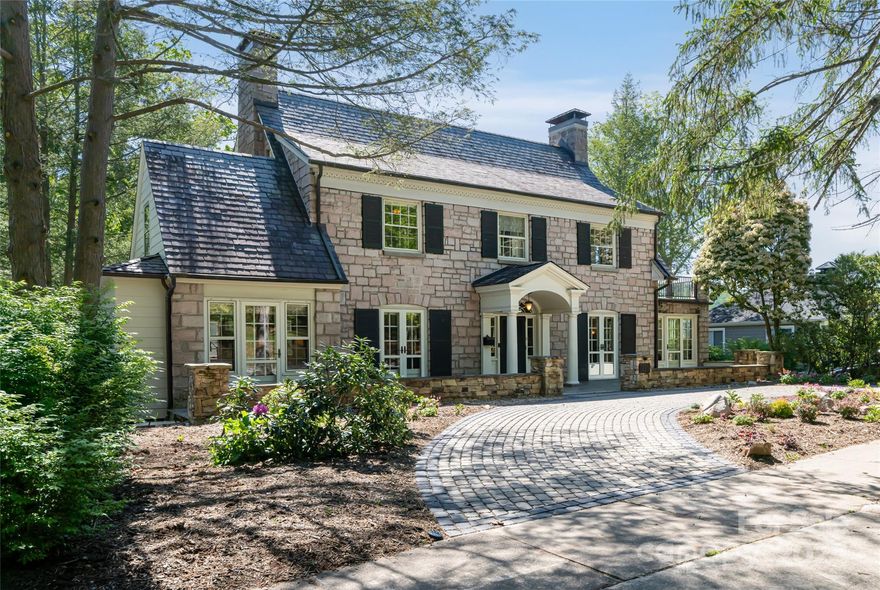 Step into history with this Grove Park Colonial Revival gem, crafted in the late 1920s by L.B. Jackson, renowned for Asheville's inaugural skyscraper. Owned by several Kimberly family sisters and esteemed figures like James G. Stikeleather, a NC senator, its legacy is palpable. Constructed with Tennessee pink granite and slate roof tiles, its meticulously maintained elegance endures. With four bedrooms, a cozy wormy chestnut den, and a sunlit sunroom, every corner whispers tales of yesteryears. Enjoy vistas of Grove Park golf course and Sunset Mountain. Own a piece of Asheville's rich narrative.