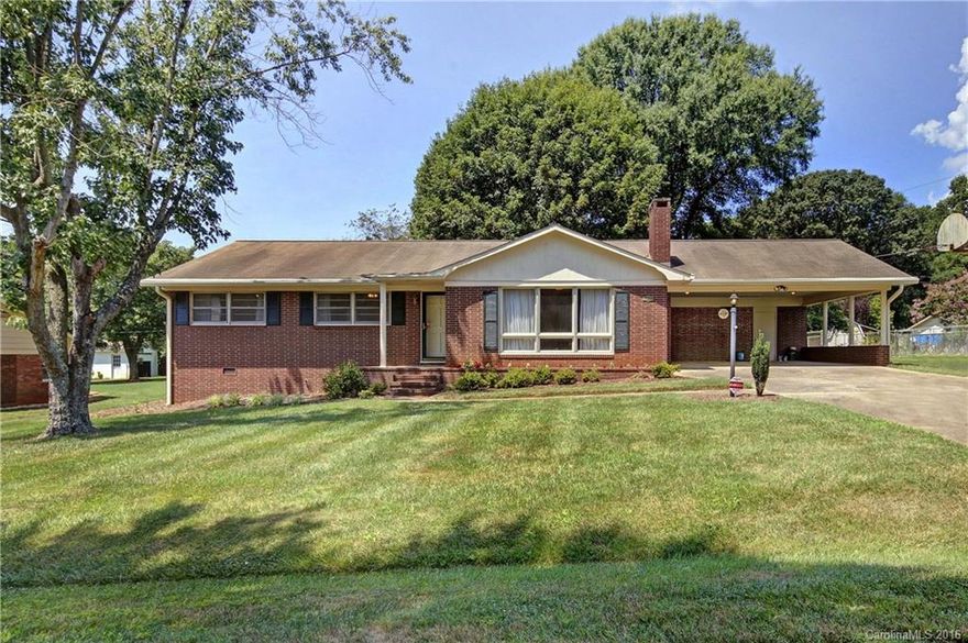 Wonderful older full brick home very well maintained in established mature neighborhood.  Home has lot's of space all on one level!  Home offers 3 bedrooms and 2 full baths. Pleasantly functionable kitchen and good sized dining room. Huge living room/great room with lots of windows, terrific brick woodburning fireplace with blowers, and beautiful hardwood floors! Sliding glass doors lead to the covered back porch and the peaceful fenced back yard that has awesome hardwood trees great climbing!