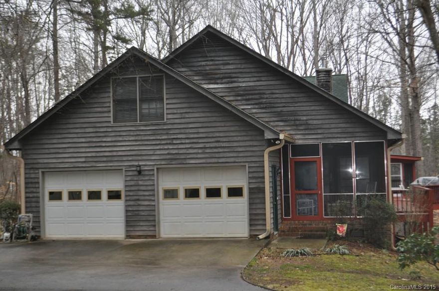 Screen porch,deck covers back of the house. Three acres,very private. lg kitchen eat in bar, new s/s appliances, butler panty. Greatrm has custom built in shelves,wood burning fireplace,french doors open to deck. Master bedroom on main floor, double vanity,garden tub,separate shower,his and her closets. Formal dining rm (currently being used for her mom) Over sized garage,utility room with custom shelves, and cabinets off mud room. 2 bedroom on upper level with additional  800 sq ft unfinished