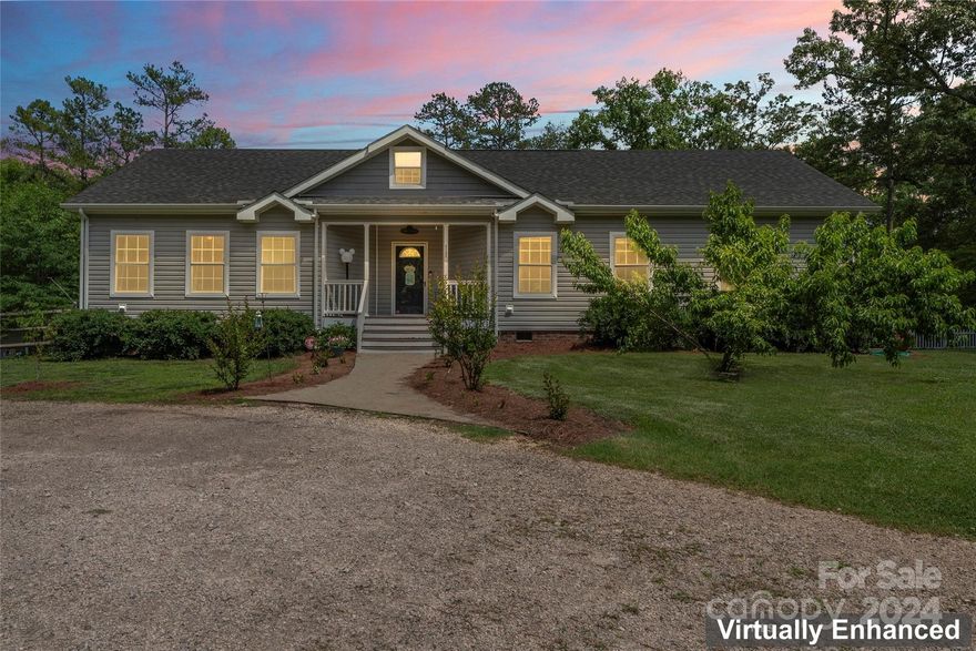 This beautiful 3 bedroom, 2 bath home is on over 2 acres (no HOA!) and boasts endless space for entertaining and relaxation. Unwind on the back patio, host gatherings in the grand pavilion with a built-in bar, or let the kids enjoy their very own air-conditioned, Alexa-powered playhouse. The fenced yard offers a safe space for pets or play, while 2 sheds (one powered) and a chicken coop will provide ample room for hobbies and projects. Inside, the home features a stunning open kitchen with stainless steel appliances and a quartz island. Luxurious primary suite has an oversized walk-in closet, soaking tub, and a double showerhead walk-in shower with a bench. There is a huge unfinished upstairs space the spans the length of the home that could easily be finished with steps added! Enjoy the hot tub, large laundry room with storage, fresh paint, plus an RV hookup!  Established fruit trees including apple, peach, fig, and blackberry bushes! Don't let this one get away!!