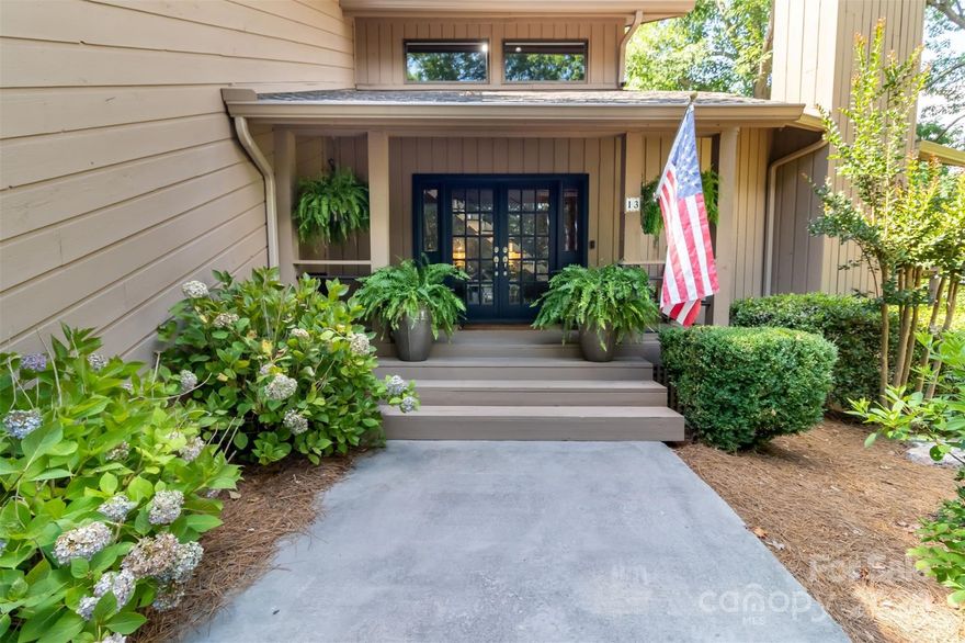 SELLERS ARE OFFERING A $20,000 CONCESSION FOR BUYER TO USE HOW THEY LIKE, AND A HOME WARRANTY! Welcome to your mountain retreat in the lakefront community of River Hills, with one of the most private lots in the neighborhood - no neighbors on either side. The unique & special home offers 5 bedrooms and 3.5 baths - with a primary suite on the main level AND upstairs! The wrap around, multi-level deck offers plenty of privacy & space while enjoying views of nature & the water. Living room boasts a large stone, wood burning fireplace & multiple doors leading out to the deck. Sunroom offers 3 season relaxation while surrounded by trees. This home packs plenty of unique features-a live edge island in the kitchen, heated floors in main level primary bath, two separate basements & two separate 2-car garages! The low maintenance lot has no grass to cut & stone steps leading down to the water. Exterior painted -2023, new roof -2022 with new skylights, & new sliding doors on main floor in 2023.