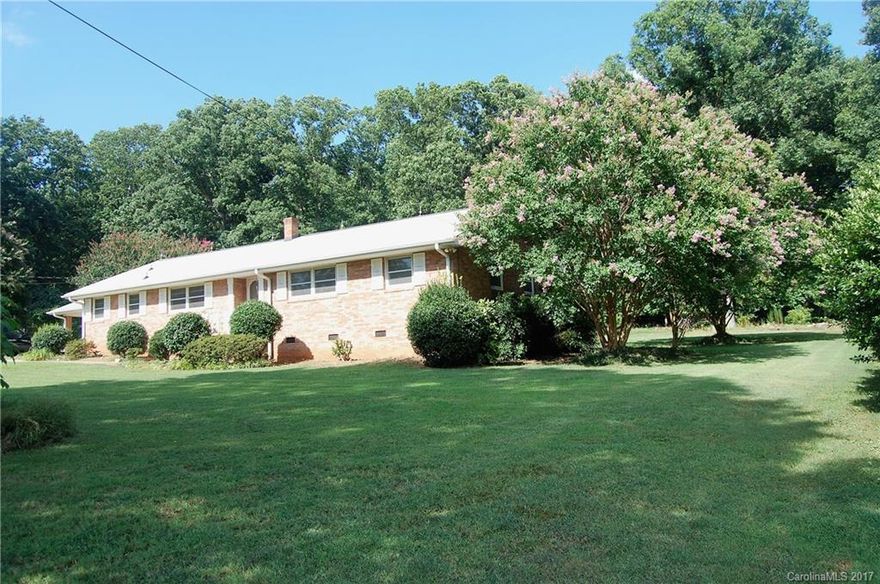 Good bones, gorgeous location! With just a little work, this ranch home will return to its former beauty. Original hardwoods, lots of space, cozy family room with wood-burning fireplace. All appliances convey! In back is a large outbuilding with electricity - make it a man cave or workshop! This is two parcels: 10516211 (.6 acre with house) and 10615210 (.6 acres with carport partially on it) for a total of 1.2+/- acres. Perfect for a garden, recreation, entertaining .. whatever you can dream!