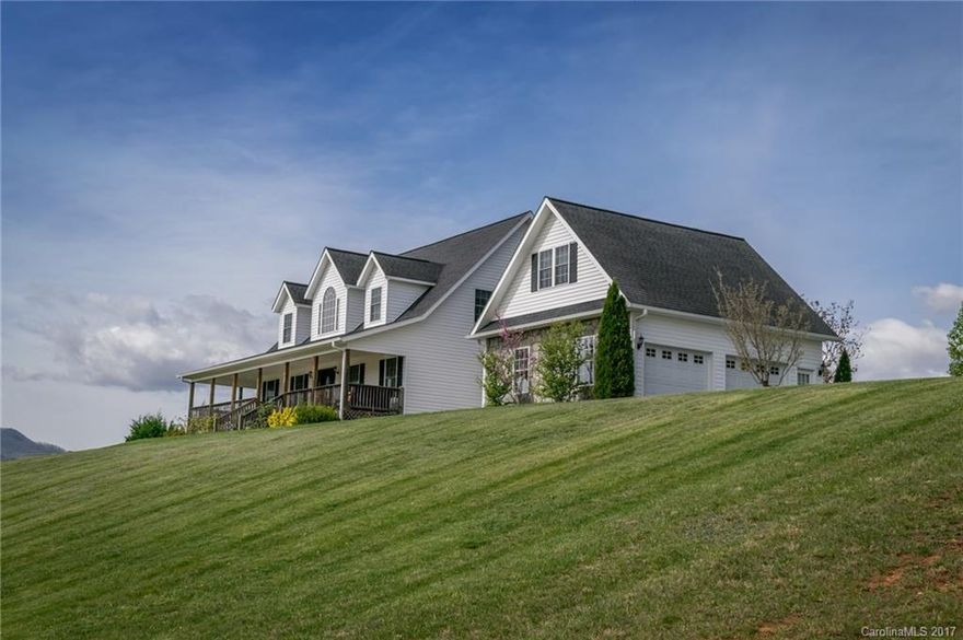 Lovely home with outstanding views. Quiet neighborhood with an easy 15 minute access to Downtown Asheville and 10 minutes to West Asheville. Eat-in kitchen with breakfast bar, formal dining room, master on main with jacuzzi tub and separate shower. Hardwood floors and tile in bath on main. Large covered wrap around porch with stunning mountain views. Back deck for entertaining and grilling, with hot tub. Plenty of storage and closet space. Bonus room above garage not included in square footage.