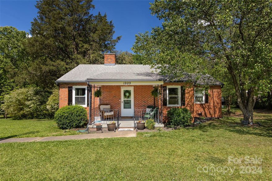 Charming three bedroom, one bath all brick home in Fort Mill!  Original hardwoods throughout most of the home, with a large screened in back porch overlooking a coveted one acre lot.  Fenced in back yard that backs up to the Ann Springs Close Greenway,  2100 acres of protected nature preserve with 40 miles of trails with lakes and ponds for lots of fun activities.   Convenient location to restaurants and shops, only one mile from downtown Fort Mill. Don't miss the opportunity to make this home your own!