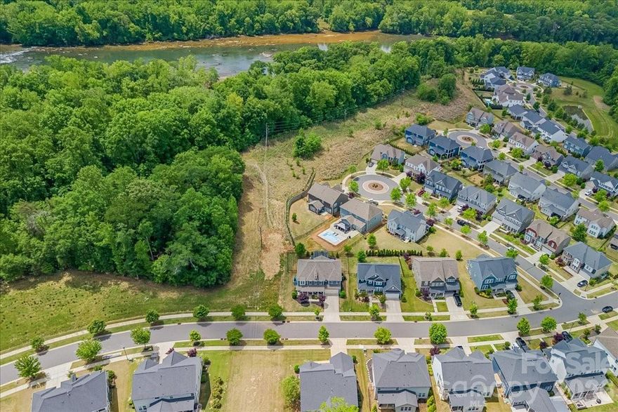 Welcome to one of the most captivating homes in the highly sought-after Masons Bend community in Fort Mill, where charm, character, and lifestyle come together in a way that’s nearly impossible to find.
Perfectly positioned on a premium corner lot, this meticulously maintained 4-bedroom, 2.5-bath home offers approximately 3,700 square feet of thoughtfully designed living space—and a setting that truly sets it apart. Imagine waking up each morning to views of a protected sunflower field right next door, providing privacy, beauty, and a rare natural backdrop that changes with the seasons.
Step inside and immediately feel the warmth and character throughout. This home was designed for both everyday living and elevated entertaining, featuring a dedicated home office/den, flexible space for a home gym, and spacious living areas filled with natural light. Every detail has been carefully cared for, offering a move-in ready experience for even the most discerning buyer.
The outdoor lifestyle here is unmatched. Just steps from your front door, enjoy direct access to scenic hiking and biking trails along the Catawba River, making it easy to stay active and connected to nature. Whether it’s a morning walk, an evening bike ride, or a peaceful moment by the water, this location delivers.
Your private backyard retreat is equally impressive—featuring a hot tub perfect for relaxing under the stars after a long day or hosting unforgettable evenings with friends and family.
Located within the top-rated Fort Mill School District, this home combines luxury living with access to some of the best schools in the region—an added value that continues to drive demand in this thriving area.
Homes like this in Masons Bend don’t come available often—especially with this level of charm, privacy, and access to nature. With its unbeatable location, flexible living spaces, and one-of-a-kind setting, this is more than just a home—it’s a lifestyle opportunity buyers wait for.
If you’ve been searching for a home that stands out from the rest, this is your moment. Opportunities like this don’t last—schedule your private showing today before someone else claims it.