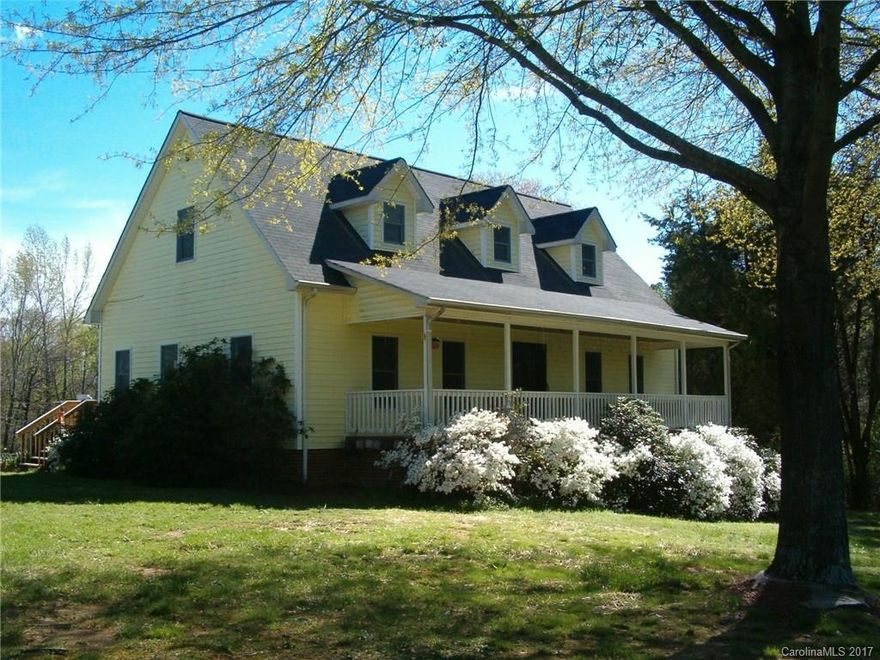 COUNTRY HOME w/ ACREAGE.  2925 sq. ft. home w/ 1950 sq. ft. basement; 11.85 private acres; 1¼ acre bass pond. Country kitchen w/ custom cabinets and appliances; laundry room w/ washer/dryer; master bedroom/bath and half bath on 1st floor; 2 bedrooms, full bath, and bonus room on 2nd floor;  all oak hardwood floors, covered 320 sq. ft. front porch, 2 new 14’ x 14’ decks, garden space and garden shop. Seller will subdivide.