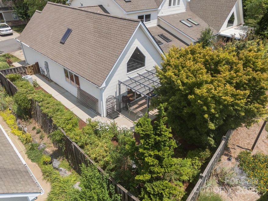 Looking for a low-maintenance home near Asheville and Black Mountain? 8 Beekeeper Trail is a bright, welcoming townhome in Bee Tree Village—one of Swannanoa’s most endearing and convenient communities. This easy-living home offers main-level living, 2 bedrooms, 3 bathrooms, an efficient layout under 1,600 sq ft, and an open floor plan with high ceilings, skylights, and sun-filled rooms that make the space feel larger. The heat pump includes a gas backup, avoiding expensive heat strips during cold mountain winters.

The seller has set a new, buyer-friendly price and is ready for the next owner. This home is in a well-loved community, and there was NO FLOOD DAMAGE from Helene to this townhome.

Inside, you’ll find a bright living area with an open flow to the dining room and kitchen—perfect for simple, everyday living. A clean, low-maintenance gas fireplace adds warmth and charm. The main-level primary suite includes a walk-in shower, and having the kitchen and washer/dryer on the same floor adds convenience. The upstairs bedroom is ideal as a guest room, home office, or creative studio, with large windows that bring in natural light.

Step outside to a private back patio and fenced garden, already established and easy to maintain. Enjoy morning coffee, gardening, or a safe space for pets. The HOA covers the roof, front lawn, and green spaces, making this a perfect choice for buyers seeking a low-maintenance lifestyle, second home, or investment property near Warren Wilson College.

Bee Tree Village sits between Asheville and Black Mountain, offering quick access to hiking trails, outdoor recreation, restaurants, shopping, and everything buyers search for in Western North Carolina. With minimal exterior upkeep, mountain surroundings, a private outdoor space, and a buyer-friendly price, this townhome delivers an ideal blend of comfort, convenience, and nature.

Please call an agent and set up an appointment to visit 8 Beekeeper Trail, a townhome as sweet as its name!